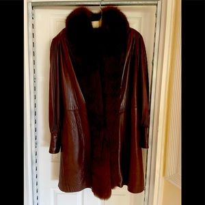 Chocolate brown fox trim leather coat.